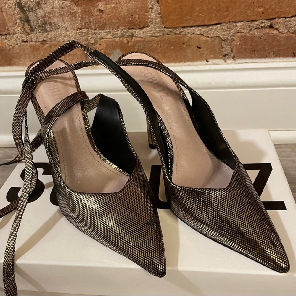 Schutz disco ball pumps in black and gold color.